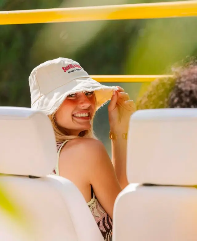 Guest smiling in Kate electric beach car open top — Retro Rides Ibiza tour lifestyle